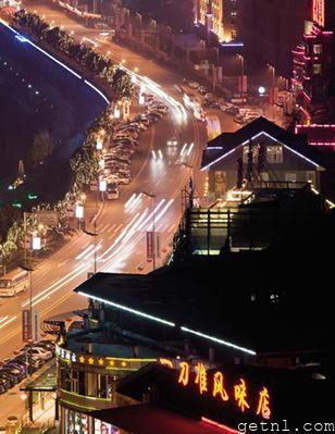 Dazzling neon illuminating the streets of Chongqing by night